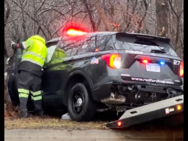Dashcam Video Shows Redford Township, Michigan Police Cruiser Lose Control in Standing Water Before Slamming Into Pole