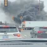 Major Crash in Michigan Shuts Down Ford Road and Haggerty Intersection After Car Becomes Trapped Under Semi Truck and Fire Breaks Out, Leaving Nine Injured Including Officers