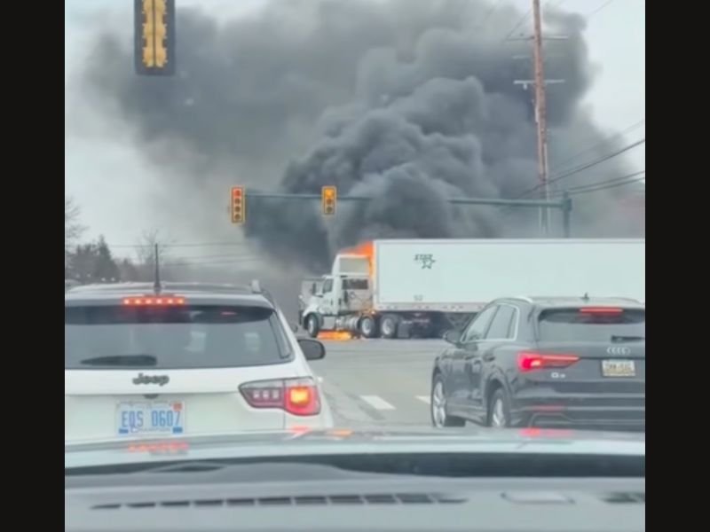 Major Crash in Michigan Shuts Down Ford Road and Haggerty Intersection After Car Becomes Trapped Under Semi Truck and Fire Breaks Out, Leaving Nine Injured Including Officers