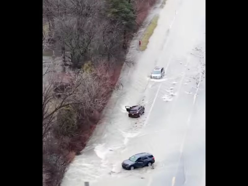 Massive Water Main Break Floods 14 Mile Road in Oakland County, Trapping Vehicles and Triggering Emergency Response