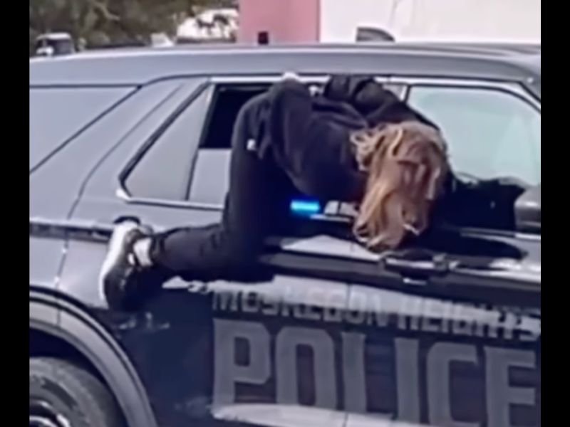 Muskegon Heights Michigan Woman Crawls Out of Police Vehicle Window While Handcuffed and Escapes as Officers Continue Search