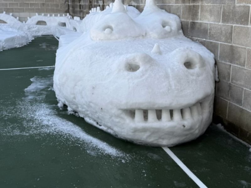 Norfolk County Jail Inmates Use Recreation Time to Build Large Snow Dragon Sculpture Inside Facility Yard